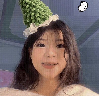 Girl In Green Hat With White Ruffle GIF