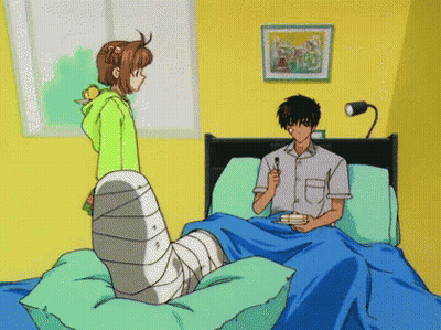 Girl In Green Hoodie Next To Boy In Bed GIF