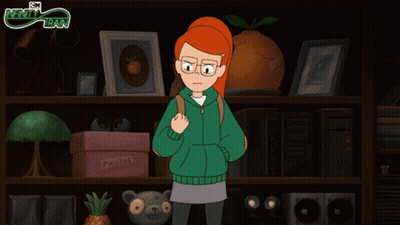 Girl In Green Jacket In Front Of Photo Shelf GIF