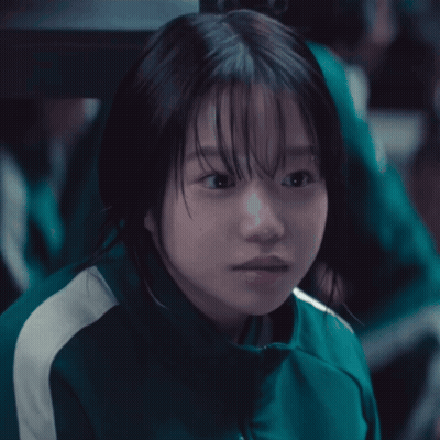 Girl In Green Jacket With White Stripes GIF