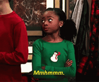 Girl In Green Shirt With Snowman Saying Mhmmm GIF