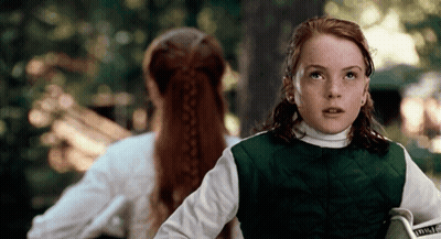 Girl In Green Vest Holding Book Saying Inside GIF