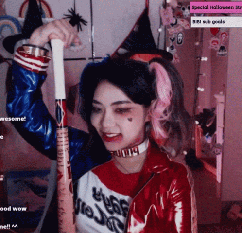 Girl In Harley Quinn Costume Holding Bat GIF