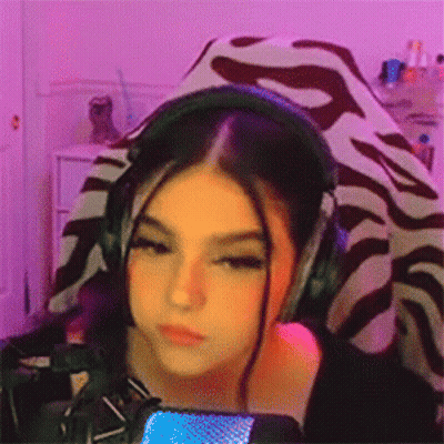 Girl In Headphones At Microphone Looking At Camera GIF