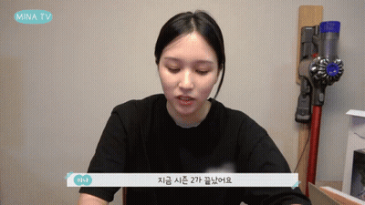 Girl In Headphones At Microphone Looking At Camera GIF