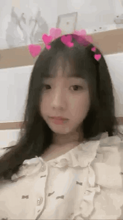 Girl In Heart Headband Laying On Bed GIF
