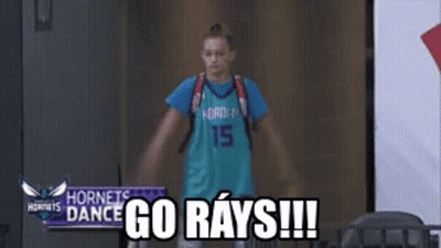 Girl In Hornets Jersey In Hallway GIF