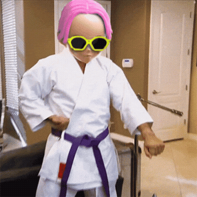 Girl In Karate Outfit And Sunglasses GIF