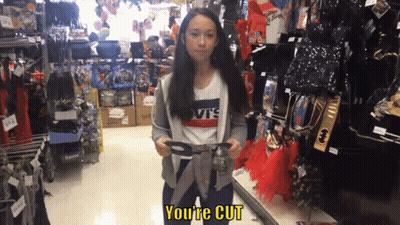 Girl In Levis Shirt Holding Scissors In Store GIF