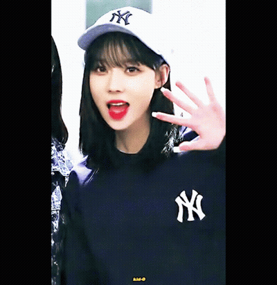 Girl In NY Baseball Cap And NY Sweatshirt GIF