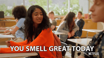 Girl In Orange Sweater Saying You Smell Great Today GIF