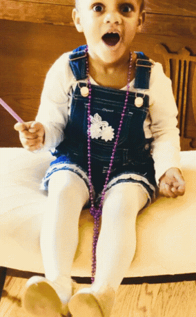 Girl In Overalls Sitting On Chair GIF