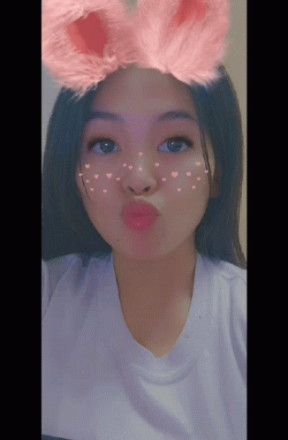 Girl In Pink Bunny Ears And Heart Face GIF