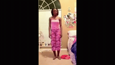 Girl In Pink Dress Dancing In Front Of Window GIF