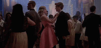 Girl In Pink Dress Dancing With Boy In Black Suit GIF