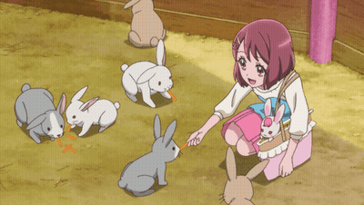 Girl In Pink Dress Feeding Rabbits GIF