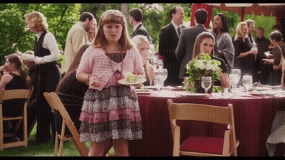 Girl In Pink Dress Holding Food GIF