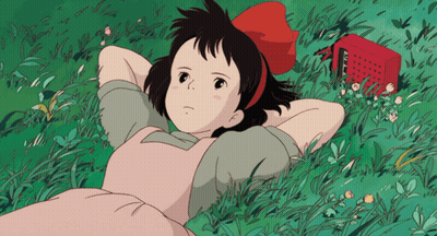 Girl In Pink Dress Laying In Grass GIF