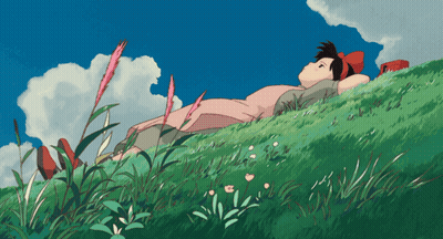 Girl In Pink Dress Laying On Grassy Hill GIF