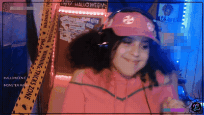 Girl In Pink Hat And Headphones In Front Of Halloween Warning Tape GIF