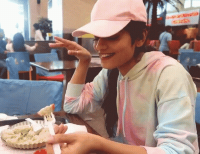 Girl In Pink Hat Eating Food GIF