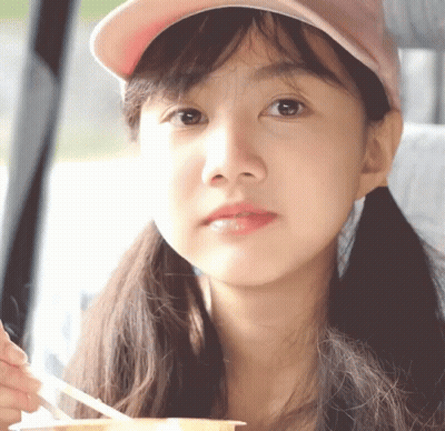 Girl In Pink Hat Holding Spoon GIF