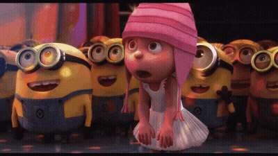 Girl In Pink Hat Surrounded By Minions GIF