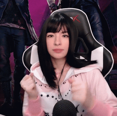 Girl In Pink Hoodie Giving Thumbs Up At Microphone GIF