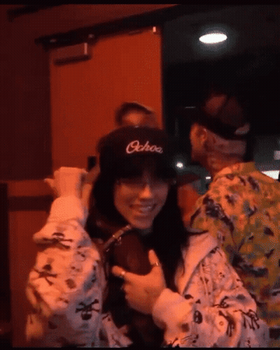 Girl In Pink Jacket Giving Middle Finger With I Love You GIF