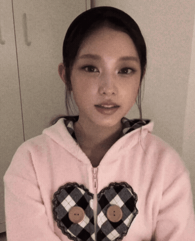 Girl In Pink Jacket With Heart GIF