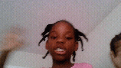 Girl In Pink Shirt With Braids GIF