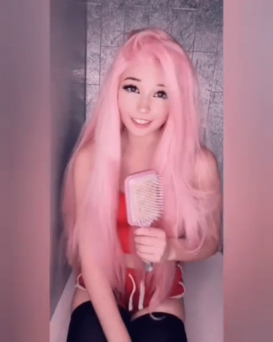 Girl In Pink Wig Holding Brush GIF
