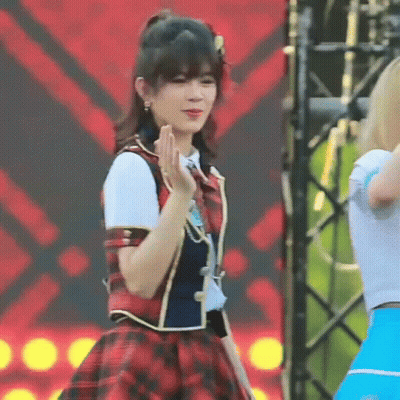 Girl in Plaid Dress Dancing on Stage