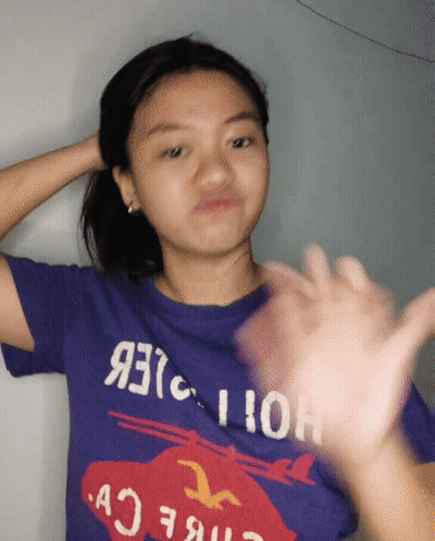Girl In Purple Hollister T-Shirt Making Funny Face GIF