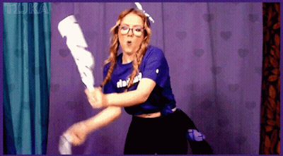 Girl In Purple Shirt With Doki Holding Bat GIF