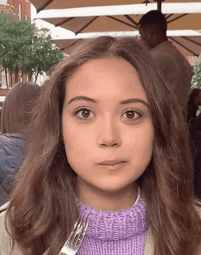 Girl In Purple Sweater Holding Fork GIF