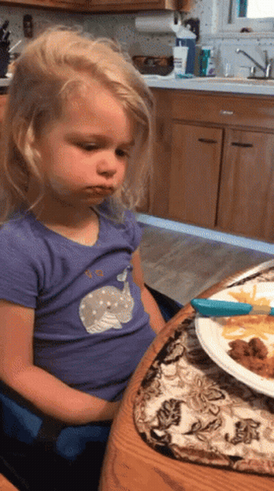 Girl In Purple Whale Shirt At Table GIF