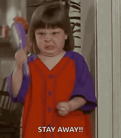Girl In Red And Purple Shirt Making Funny Face GIF