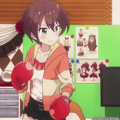 Girl In Red Boxing Gloves In Front Of Poster Wall GIF