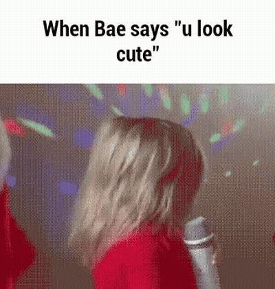Girl in Red Hoodie Dancing at Microphone Saying When Bae Says You Look Cute
