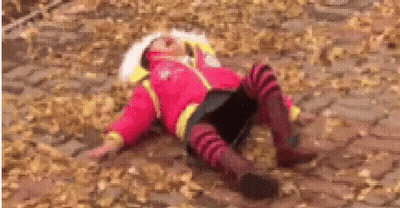 Girl In Red Jacket Lying In Leaves GIF