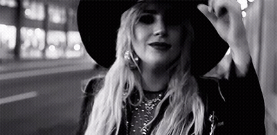 Girl In Red Oxxo Hat Peeking Over Counter GIF