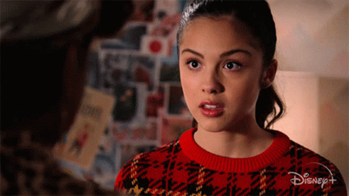 Girl In Red Sweater With Disney Logo GIF