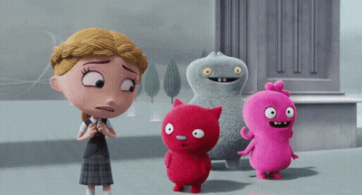Girl In School Uniform Next To Stuffed Animals GIF