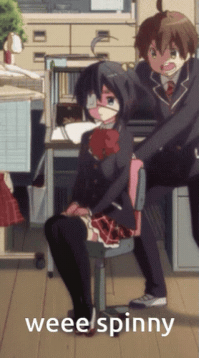 Girl In School Uniform Sitting By Boy In Suit Saying Wee Spinny GIF