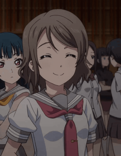 Girl In School Uniform Smiling In Crowd GIF