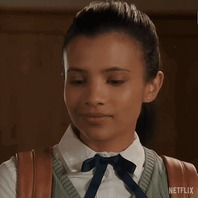 Girl In School Uniform Smiling With Eyes Closed GIF