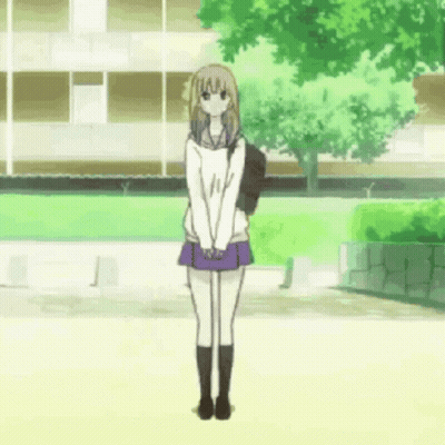 Girl In School Uniform Standing In Front Of Building GIF
