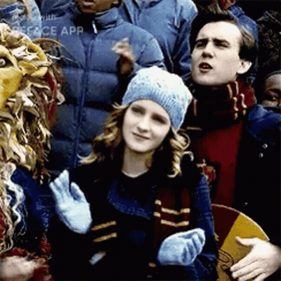 Girl In School Uniform With 'A' Badge GIF