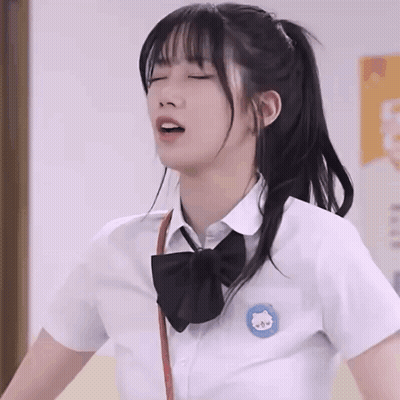 Girl In School Uniform With Cat Embroidery GIF
